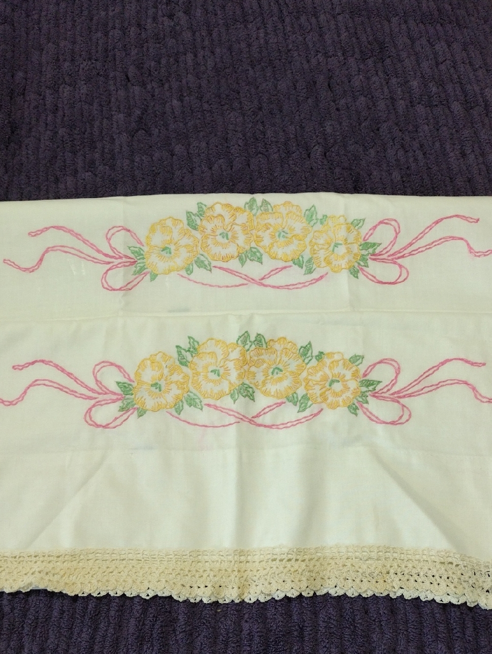 Hand-Embroidered Floral Pillowcases with Pink Ribbon Accents